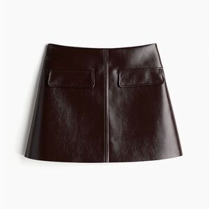 SOLD OUT EVERYWHERE Brand New coated mini skirt